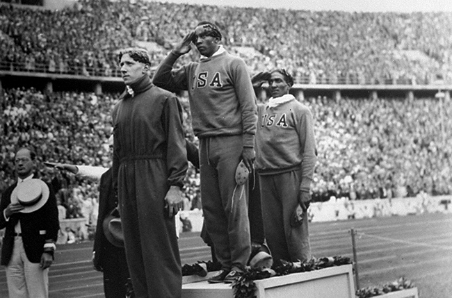 American John Woodruff receives a gold medal at the 1936 Berlin Olympics. Bundesarchiv G00628
